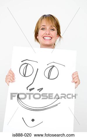 Stock Image - Woman holding drawing. Fotosearch