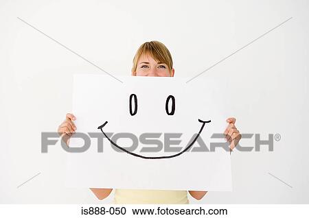 Stock Image - Woman holding drawing. Fotosearch