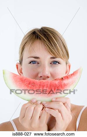 Woman holding slice of watermelon View Large Photo Image Stock Photo - Woman holding slice of watermelon. Fotosearch
