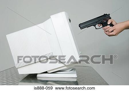 Stock Photo - Woman shooting computer monitor. Fotosearch