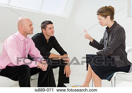 Businesspeople having a meeting View Large Photo Image Stock Image - Businesspeople having a meeting. Fotosearch