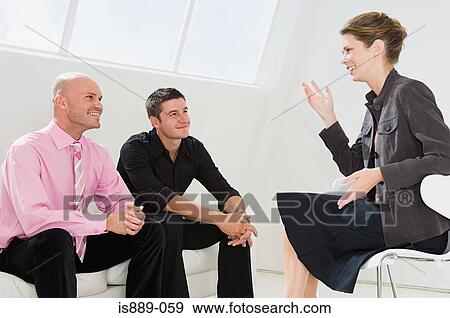 Businesspeople in a meeting View Large Photo Image Stock Photo - Businesspeople in a meeting. Fotosearch