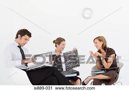 Businesspeople working View Large Photo Image Stock Image - Businesspeople working. Fotosearch