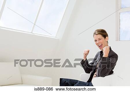 Businesswoman cheering View Large Photo Image Stock Photograph - Businesswoman cheering. Fotosearch