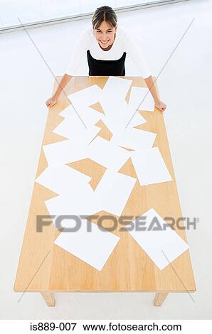 Stock Photo - Office worker with paper work. Fotosearch