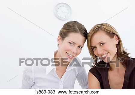 Portrait of two office workers View Large Photo Image Stock Image - Portrait of two office workers. Fotosearch
