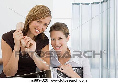 Two office workers View Large Photo Image Stock Photograph - Two office workers. Fotosearch