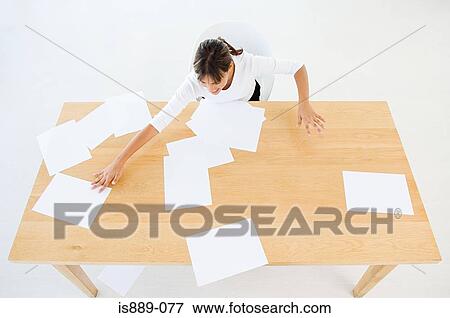 Woman sorting paper work View Large Photo Image Stock Photo - Woman sorting paper work. Fotosearch