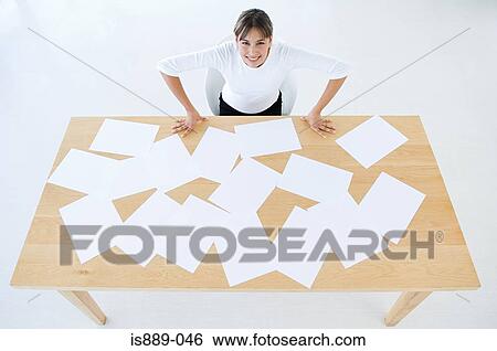 Woman with desk of paper work View Large Photo Image Stock Photograph - Woman with desk of paper work. Fotosearch