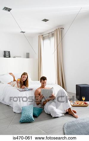 Couple reading in bedroom View Large Photo Image Stock Image - Couple reading in bedroom. Fotosearch