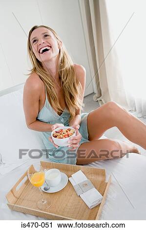 Happy woman with breakfast View Large Photo Image Stock Image - Happy woman with breakfast. Fotosearch