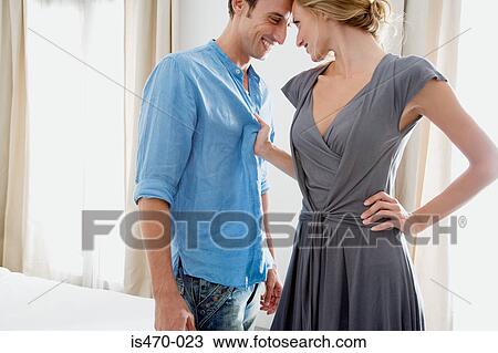Stock Image - Woman grabbing man. Fotosearch