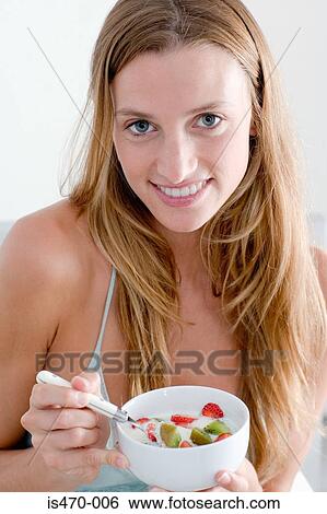 Stock Photograph - Woman having breakfast. Fotosearch
