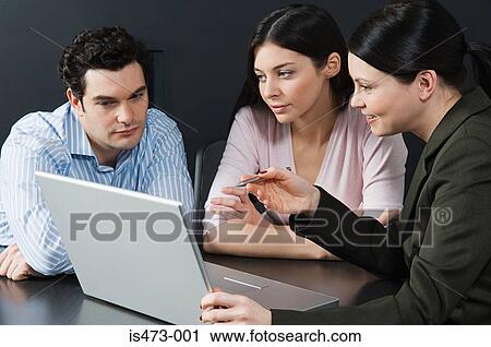 Stock Image - Bank manager helping couple. Fotosearch