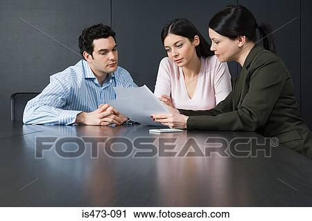 Bank manager helping couple View Large Photo Image Stock Image - Bank manager helping couple. Fotosearch