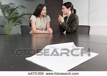 Picture - Bank manager helping customer. Fotosearch
