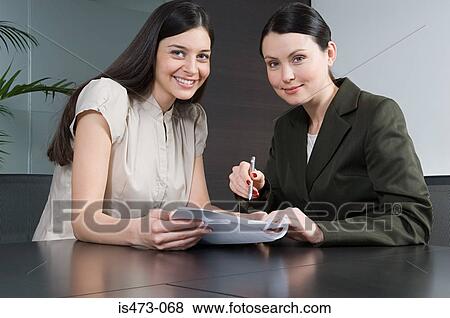 Bank manager helping customer View Large Photo Image Stock Photo - Bank manager helping customer. Fotosearch