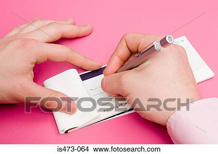 Man signing cheque book View Large Photo Image Picture - Man signing cheque book. Fotosearch