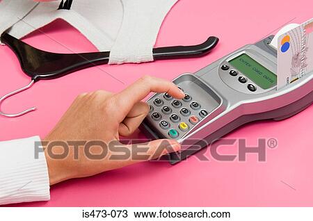 Stock Image - Person entering pin. Fotosearch