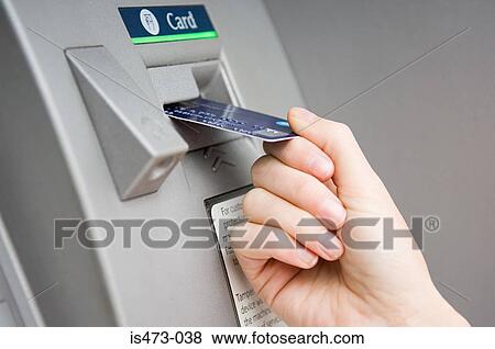 Person puttting card into cash machine View Large Photo Image Stock Photo - Person puttting card into cash machine. Fotosearch