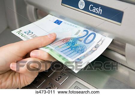 Person withdrawing cash View Large Photo Image Stock Image - Person withdrawing cash. Fotosearch