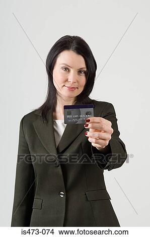 Woman holding credit card View Large Photo Image Picture - Woman holding credit card. Fotosearch