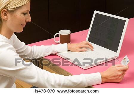 Stock Image - Woman internet banking. Fotosearch