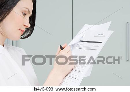 Woman signing paperwork View Large Photo Image Stock Image - Woman signing paperwork. Fotosearch