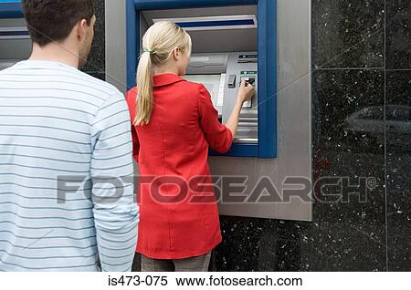 Woman using cash machine View Large Photo Image Stock Photography - Woman using cash machine. Fotosearch