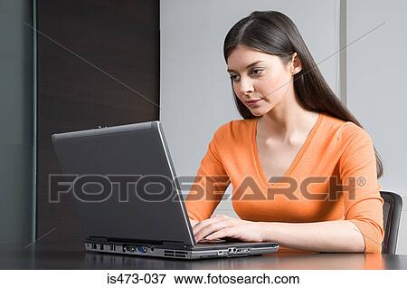 Stock Photo - Woman using laptop. Fotosearch