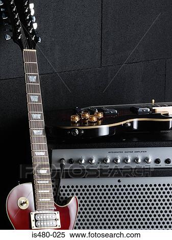 Electric guitars and amplifier View Large Photo Image Stock Photography - Electric guitars and amplifier. Fotosearch