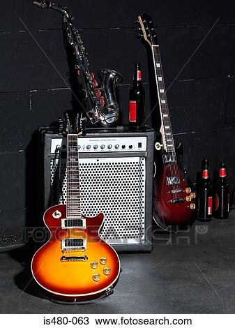 Musical instruments and beer bottles View Large Photo Image Stock Image - Musical instruments and beer bottles. Fotosearch