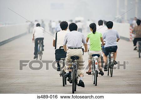 Chinese people cycling View Large Photo Image Stock Photograph - Chinese people cycling. Fotosearch