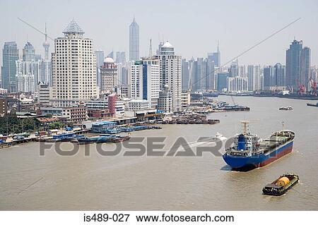 Stock Photo - Freighter on pudong river. Fotosearch