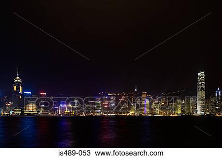 Stock Image - Hong kong skyline at night. Fotosearch