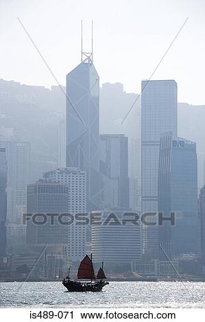 Sailboat near hong kong skyscrapers View Large Photo Image Stock Image - Sailboat near hong kong skyscrapers. Fotosearch
