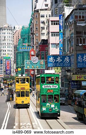 Stock Photo - Trams on a hong kong street. Fotosearch
