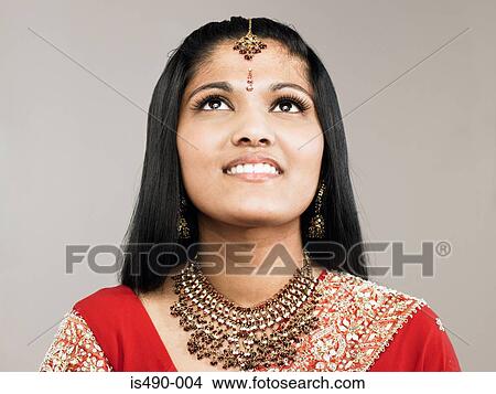 Picture - Young woman looking up. Fotosearch