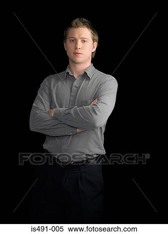 Stock Photography - Young man with crossed arms. Fotosearch