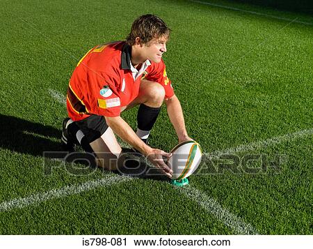Rugby player placing ball View Large Photo Image Stock Image - Rugby player placing ball. Fotosearch