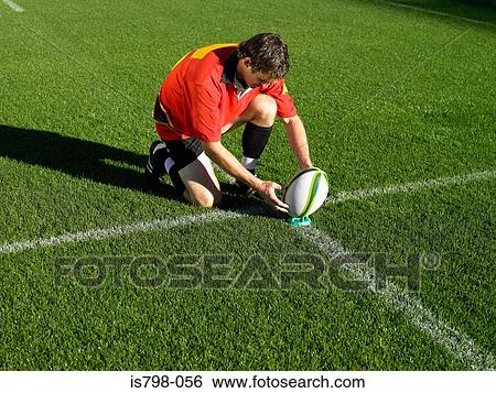 Rugby player placing ball View Large Photo Image Stock Photograph - Rugby player placing ball. Fotosearch