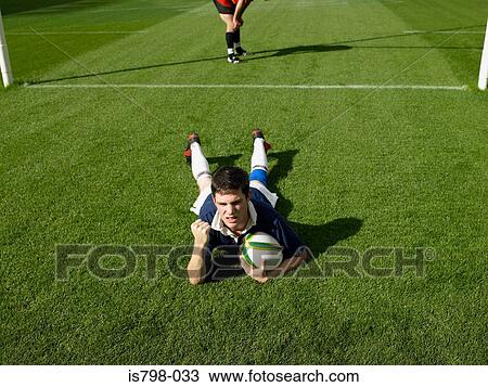 Rugby player scoring a try View Large Photo Image Stock Image - Rugby player scoring a try. Fotosearch