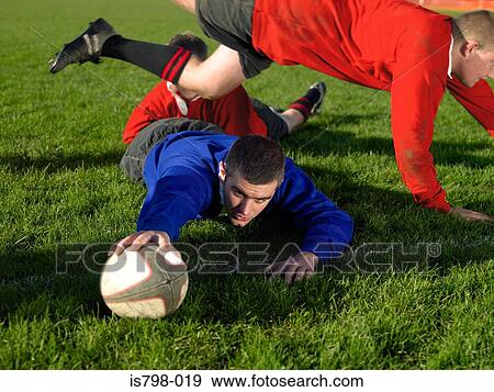 Rugby player scoring a try View Large Photo Image Stock Photo - Rugby player scoring a try. Fotosearch