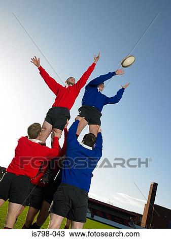 Rugby players practising View Large Photo Image Stock Image - Rugby players practising. Fotosearch