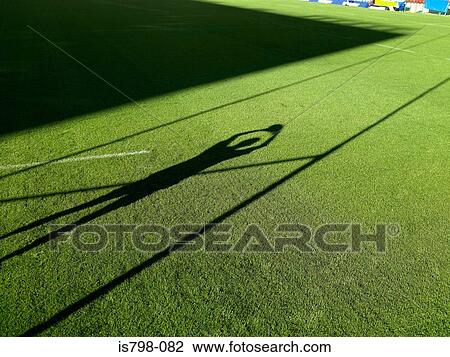 Shadow of rugby player and rugby post View Large Photo Image Stock Image - Shadow of rugby player and rugby post. Fotosearch