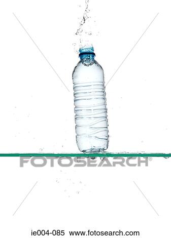 Bottle of water being dropped View Large Photo Image Stock Photography - Bottle of water being dropped. Fotosearch