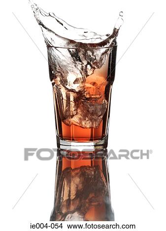 Ice cube dropping into drink View Large Photo Image Picture - Ice cube dropping into drink. Fotosearch