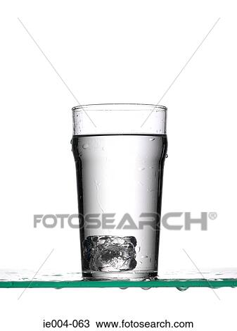Ice cube in glass of water View Large Photo Image Stock Image - Ice cube in glass of water. Fotosearch