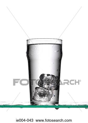 Ice cubes in glass of water View Large Photo Image Stock Image - Ice cubes in glass of water. Fotosearch