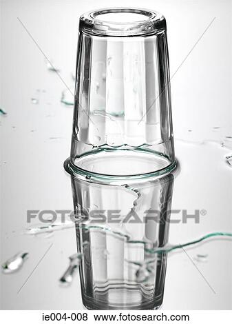 Upside down glass and water View Large Photo Image Stock Photo - Upside down glass and water. Fotosearch